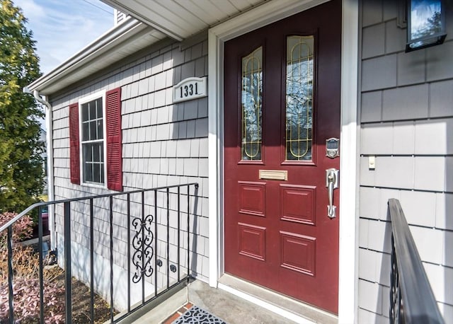 view of exterior entry featuring a porch