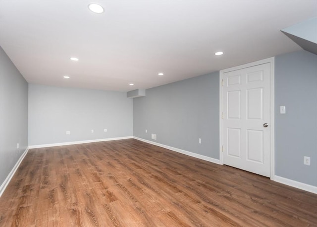 unfurnished room with recessed lighting, baseboards, and wood finished floors