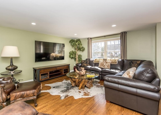 living room with recessed lighting, wood finished floors, and baseboards