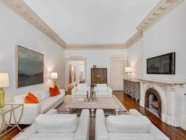 living room with crown molding and dark wood-type flooring