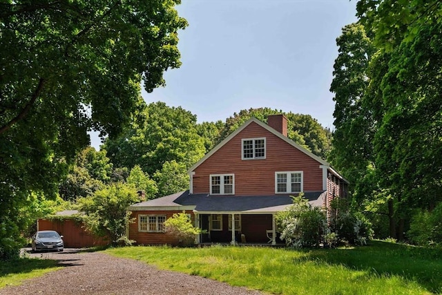 584 Woburn St, Wilmington, MA 01887 - view of front facade featuring a chimney and driveway