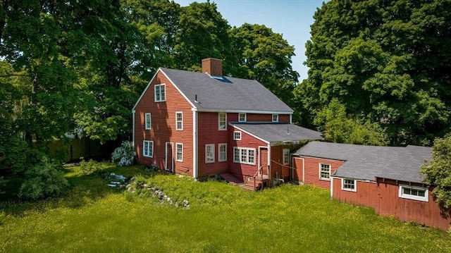 584 Woburn St, Wilmington, MA 01887 - back of property featuring a chimney and a yard
