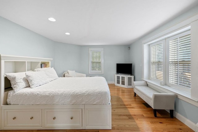 bedroom featuring recessed lighting, baseboards, and light wood finished floors