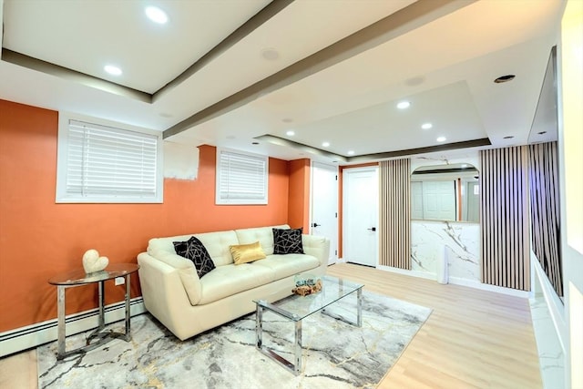 living room featuring a tray ceiling, recessed lighting, wood finished floors, and baseboard heating