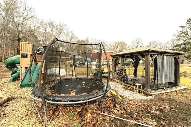 communal playground featuring a gazebo and a trampoline