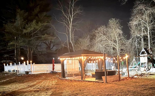 view of property's community featuring a gazebo and fence