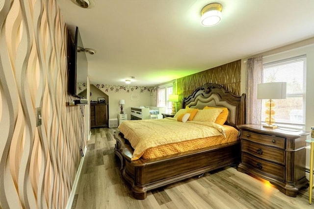 bedroom with light wood-style flooring