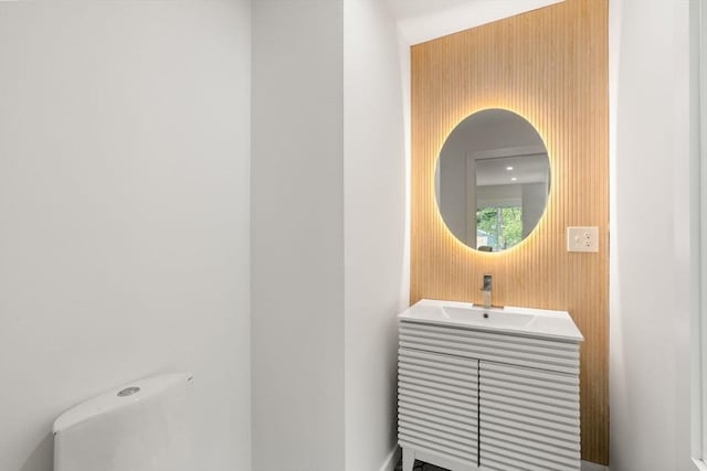 174 Gilbert St, Mansfield, MA 02048 - half bathroom featuring vanity and wooden walls