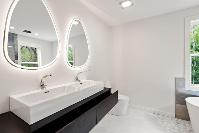 174 Gilbert St, Mansfield, MA 02048 - full bathroom with a soaking tub, double vanity, and recessed lighting