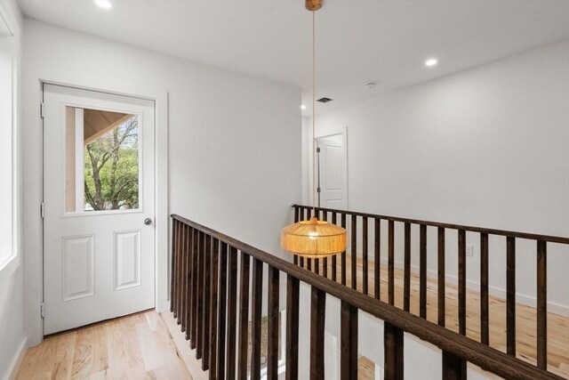 174 Gilbert St, Mansfield, MA 02048 - hallway with an upstairs landing, light wood-style floors, and recessed lighting