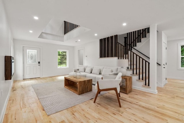 174 Gilbert St, Mansfield, MA 02048 - living room with wood finished floors, stairway, recessed lighting, and a raised ceiling