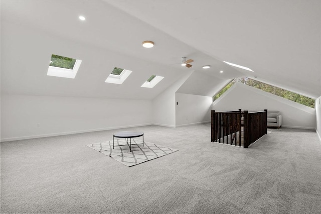 174 Gilbert St, Mansfield, MA 02048 - bonus room featuring a skylight, lofted ceiling, light colored carpet, recessed lighting, and plenty of natural light
