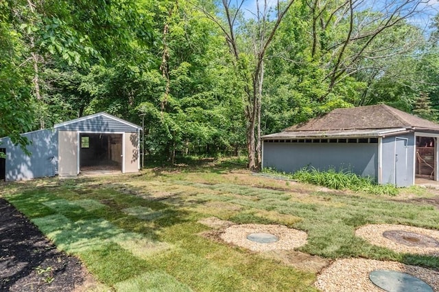 174 Gilbert St, Mansfield, MA 02048 - view of grassy yard featuring an outbuilding