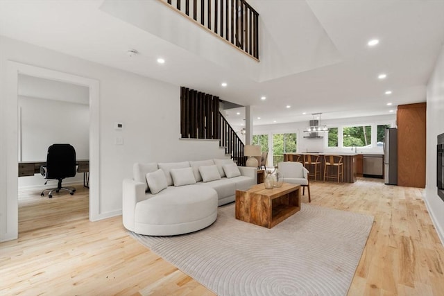 174 Gilbert St, Mansfield, MA 02048 - living room featuring light wood-style floors, an office area, recessed lighting, and stairway