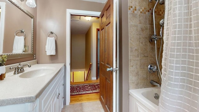 bathroom with shower / bath combination with curtain, tile patterned flooring, and vanity