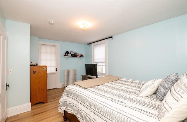 35 Locust St Unit 3, Danvers, MA 01923 - bedroom with radiator and light wood finished floors