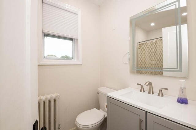 35 Locust St Unit 3, Danvers, MA 01923 - bathroom with radiator heating unit and vanity