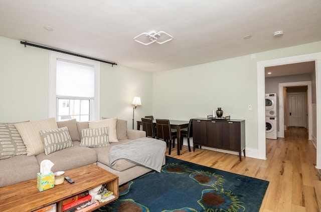 35 Locust St Unit 3, Danvers, MA 01923 - living room featuring estacked washer and dryer and wood finished floors