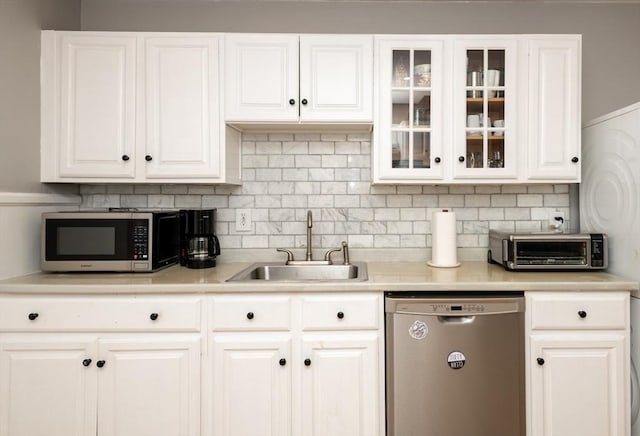 35 Locust St Unit 3, Danvers, MA 01923 - kitchen with stainless steel appliances, white cabinetry, light countertops, and glass insert cabinets