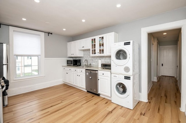 35 Locust St Unit 3, Danvers, MA 01923 - laundry area with stacked washer / drying machine, light wood-type flooring, and recessed lighting