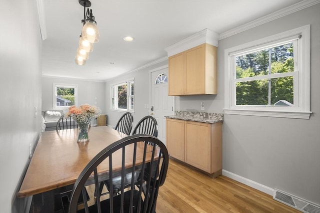 56 Country Way, Whitman, MA 02382 - dining space featuring light wood-style floors, crown molding, baseboards, and recessed lighting