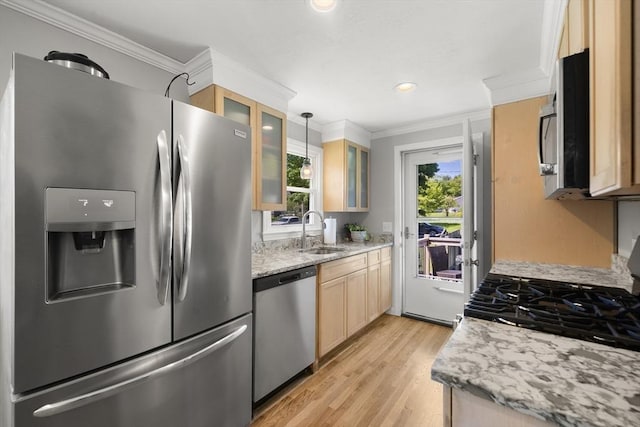 56 Country Way, Whitman, MA 02382 - kitchen featuring stainless steel appliances, a sink, ornamental molding, light brown cabinetry, and light wood-style flooring