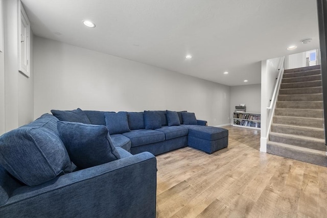 56 Country Way, Whitman, MA 02382 - living room with stairway, recessed lighting, light wood finished floors, and baseboards