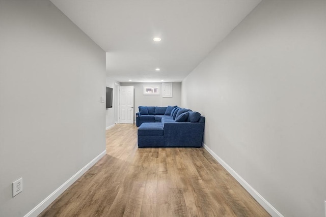 56 Country Way, Whitman, MA 02382 - living area with wood finished floors, baseboards, and recessed lighting