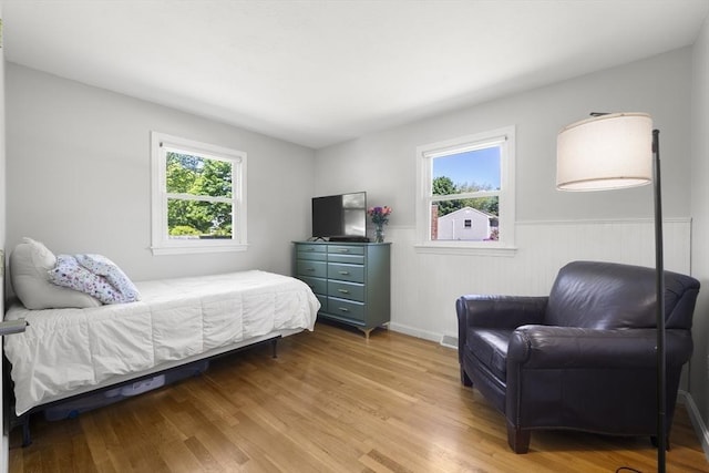 56 Country Way, Whitman, MA 02382 - bedroom with multiple windows, wood finished floors, and wainscoting