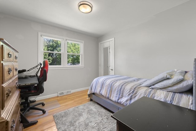 56 Country Way, Whitman, MA 02382 - bedroom with a desk, light wood-style floors, and baseboards