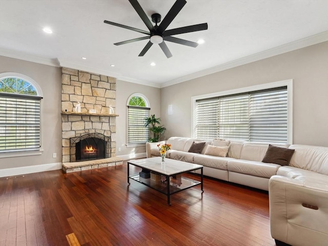 231 Gulf St, Shrewsbury, MA 01545 - living area featuring ornamental molding, ceiling fan, hardwood / wood-style flooring, baseboards, and a stone fireplace