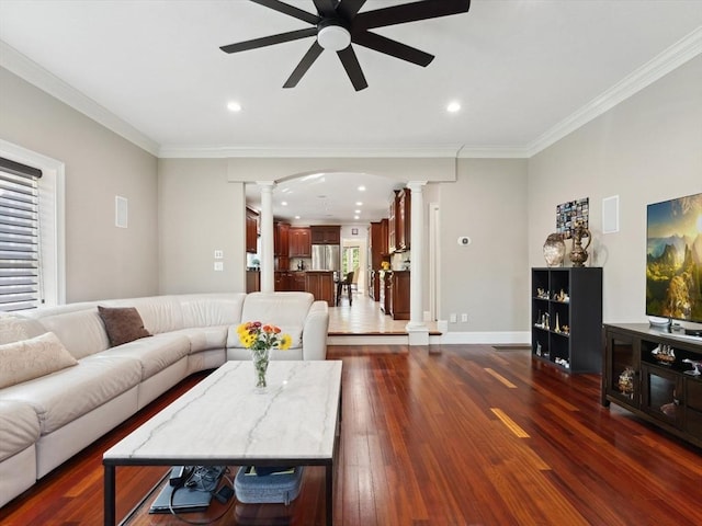 231 Gulf St, Shrewsbury, MA 01545 - living area with ornate columns, ceiling fan, arched walkways, ornamental molding, and dark wood finished floors