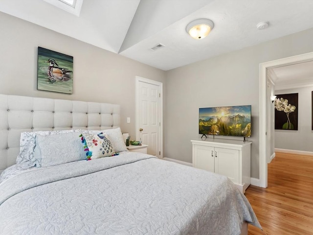 231 Gulf St, Shrewsbury, MA 01545 - bedroom with light wood-type flooring, baseboards, a skylight, and lofted ceiling