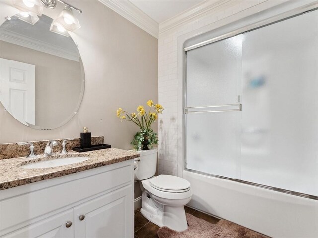 231 Gulf St, Shrewsbury, MA 01545 - bathroom with crown molding, vanity, toilet, tile patterned floors, and enclosed tub / shower combo
