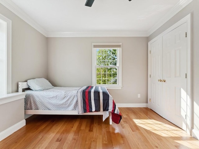 231 Gulf St, Shrewsbury, MA 01545 - bedroom with crown molding, baseboards, wood finished floors, ceiling fan, and a closet