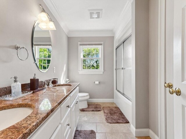 231 Gulf St, Shrewsbury, MA 01545 - full bath with crown molding, toilet, double vanity, bath / shower combo with glass door, and baseboards