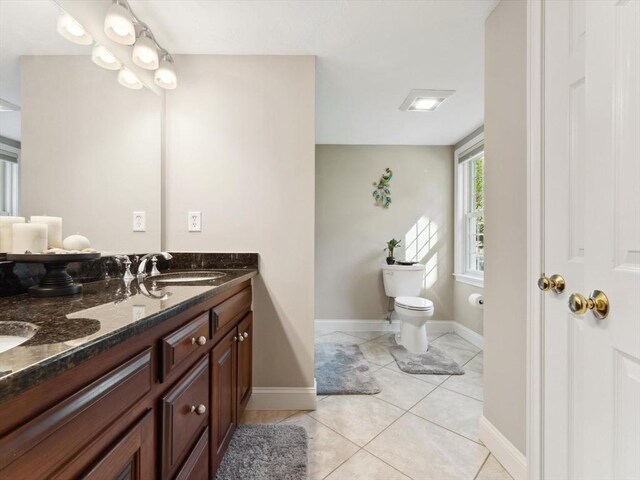 231 Gulf St, Shrewsbury, MA 01545 - full bath featuring toilet, double vanity, baseboards, and tile patterned flooring