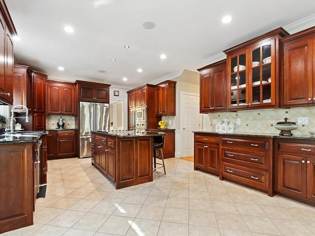 231 Gulf St, Shrewsbury, MA 01545 - kitchen with stainless steel appliances, decorative backsplash, ornamental molding, glass insert cabinets, and light tile patterned floors