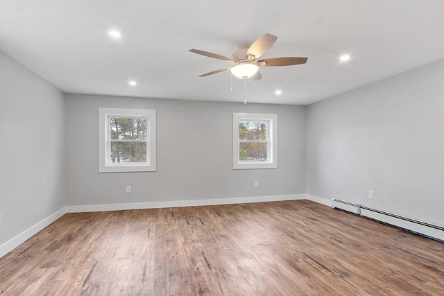 empty room with light hardwood / wood-style flooring and ceiling fan