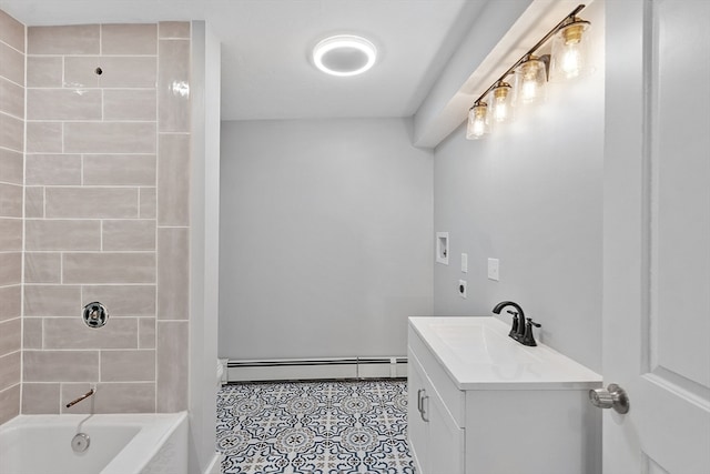 bathroom featuring vanity, a baseboard radiator, and tiled shower / bath combo