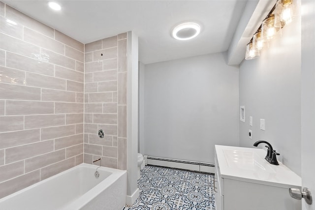 full bathroom featuring vanity, a baseboard radiator, toilet, and tiled shower / bath