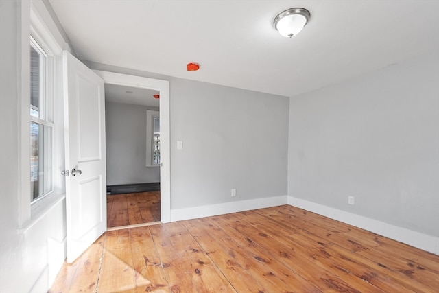 empty room with wood-type flooring