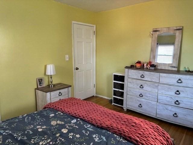 bedroom featuring dark hardwood / wood-style floors