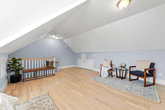 bonus room featuring vaulted ceiling, wood finished floors, and baseboards