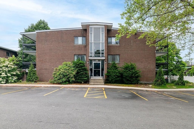 150 Elm St Unit 1, Braintree, MA 02184 - view of building exterior with uncovered parking and entry steps