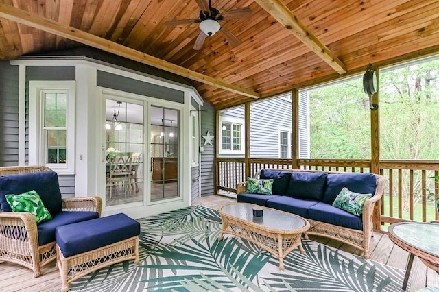 sunroom / solarium with an outdoor living space, a ceiling fan, and plenty of natural light