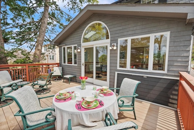 deck with outdoor dining area