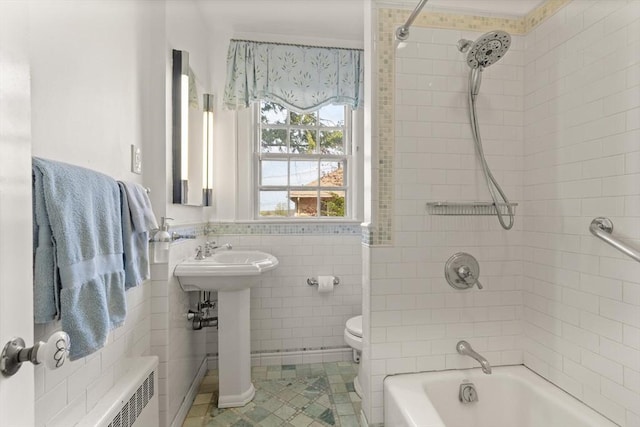 full bathroom featuring shower / bath combination, tile walls, tile patterned flooring, toilet, and radiator heating unit