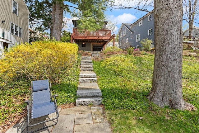 view of yard with stairway and a wooden deck