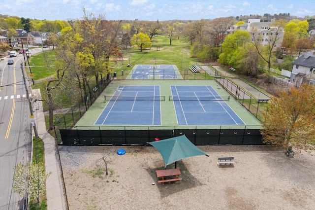 view of sport court with fence